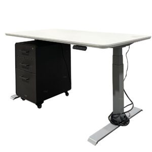 Used VARIDESK Height Adjustable Desk with Mobile BBF Pedestal in White Surface and Silver Legs This height-adjustable desk offers flexibility and functionality, paired with a mobile box-box-file pedestal for additional storage. White laminated surface with silver legs for a clean, professional look Height-adjustable design for ergonomic comfort Mobile BBF pedestal with box, box, and file storage for added organization Dimensions: 59.5/8"W x 30"D  Perfect for modern offices, individual workstations, and dynamic work environments.