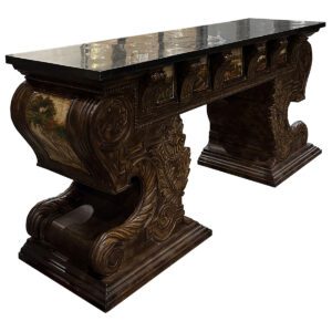 Used 72" W Ornate Console Table W/ Black Granite Surface This console table features a durable black granite surface atop an intricately detailed base, adorned with landscape images of trees, valleys, and pastures. Black granite surface Ornate base with landscape imagery Elegant craftsmanship Dimensions: 72 1/8"W x 21"D x 32 3/4"H Ideal for reception areas, lobbies, or residential entryways seeking a refined touch.