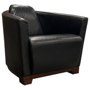 Used Calia Black Leather Lounge Chair This black leather lounge chair by Calia Italia features sleek Art Deco-inspired lines and a compact design, perfect for adding luxury to any setting. Light wear from previous use adds character to this timeless piece, making it a stylish choice for relaxation. Black leather upholstery Made in Italy Light wear consistent with age and use Dimensions: 32"W x 32"D x 29"H Ideal for lobbies, reception areas, and office lounges.